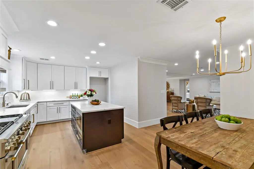 Open-concept white cabinetry with island