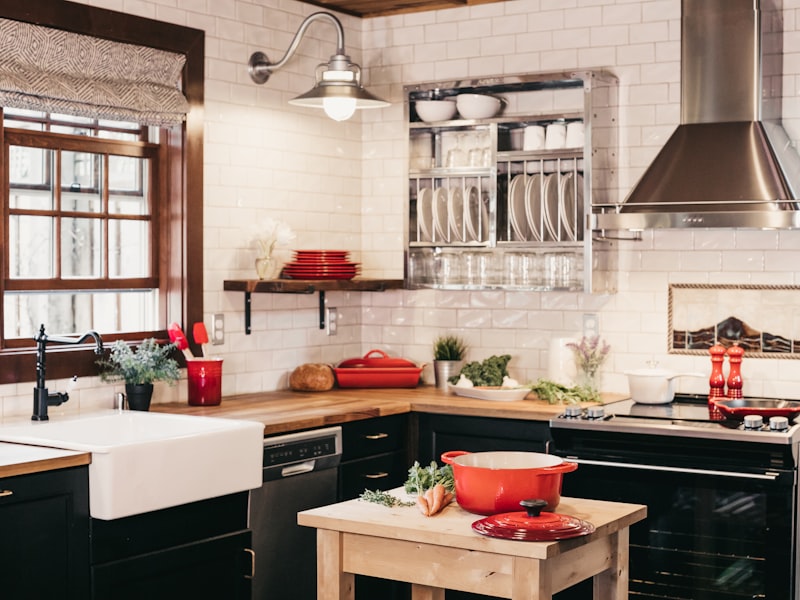 Modern kitchen renovation with white cabinets and quartz countertops