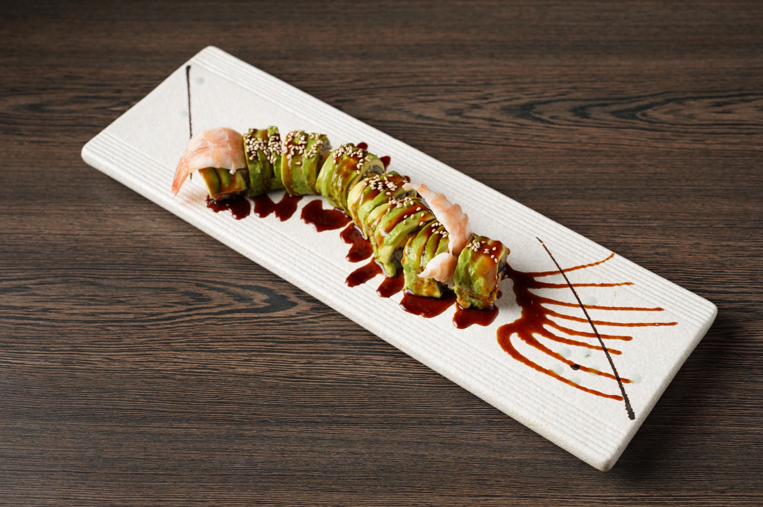 The warm, modern dining room at KIMOTO Premium Sushi in Houston